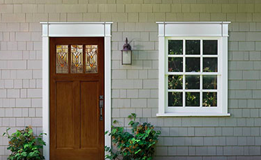 Front door and window with pediments