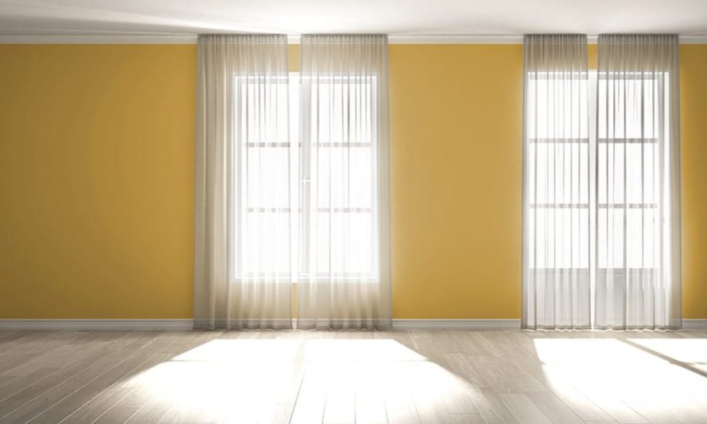 Yellow walls with White Curtains