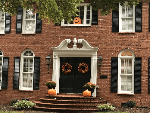 Fall wreath on door of brick home