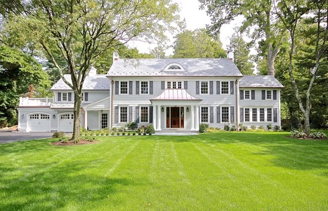 Colonial house with white windows.