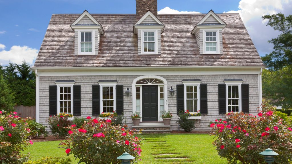 Cape cod house with white and black windows